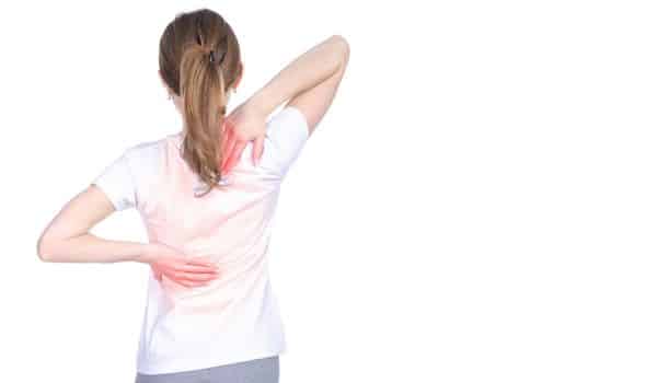 What is the connection between large breasts and back pain?